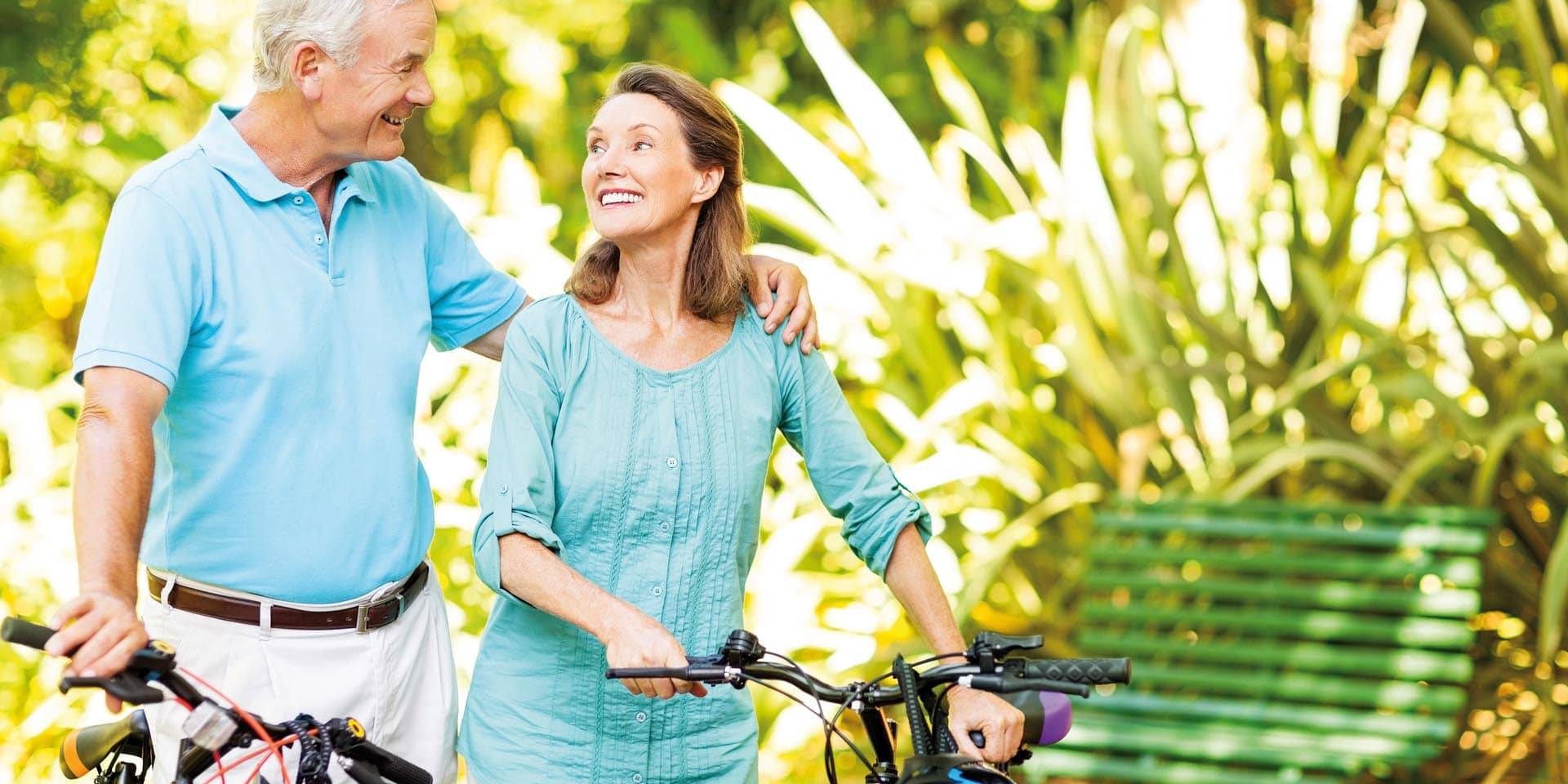 Loving-Senior-Couple-Holding-Bicycles-In-Park-000045279726_XXXLarge